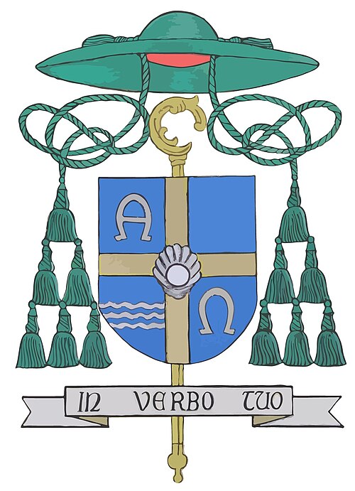 Descrição heráldica: Encimando o escudo está o chapéu da dignidade episcopal, do qual saem dois cordões de seda, um em cada lado, com três fileiras de borlas, em sinopla (verde). O escudo está pousado sobre um báculo pastoral em jalde (ouro) que indica a missão do bispo. Sob o conjunto, encontra-se um listel com a divisa em latim: IN VERBO TUO (na tua Palavra) escrita com letras em negro. O escudo tem a forma de cálice, e todo o campo é em blau (azul), tendo, no centro, a cruz heráldica dourada.