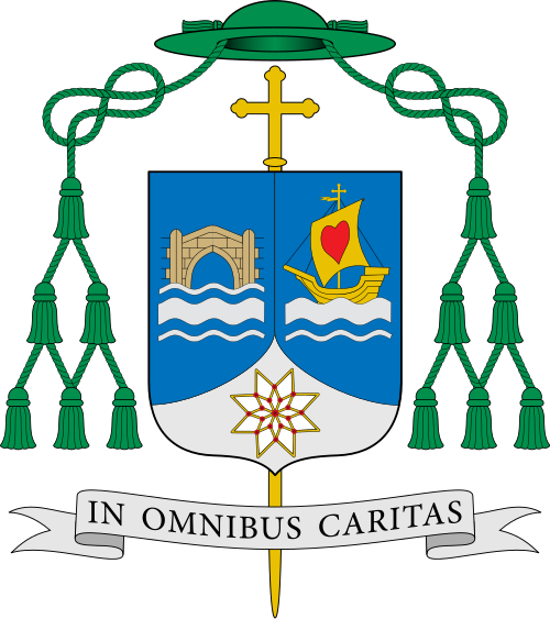Escudo de Fernando García Cadiñanos. Trae: Primero: de azur, puente de piedra al estilo gótico en su esmalte natural, mazonado de sable, sostenido de dos cintas y faja ondadas de plata. Segundo: de azur, nao de oro con vela de lo mismo adornada de corazón de gules, mástil acolado de cruz; sostenido de cinta y faja ondadas de plata. Entado: de plata, estrella de ocho puntas de oro (más allá de las leyes heráldicas), esquema arquitectónico de la plementería del cimborrio de la seo burgalesa, ador